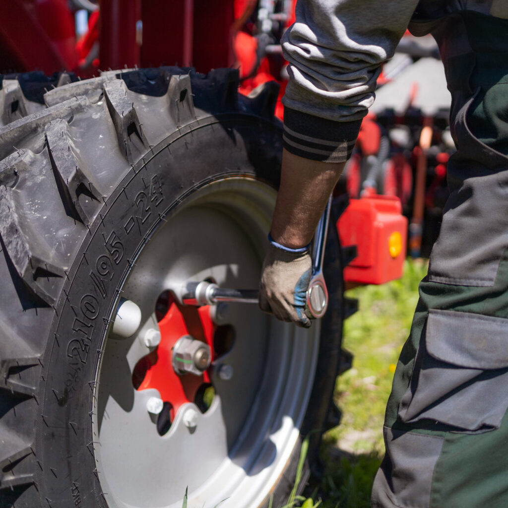 a mechanic repairs agricultural machinery. modern agricultural machinery and equipment.
